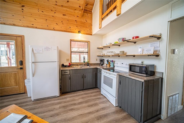 kitchen featuring gray cabinetry, sink, white appliances, and light hardwood / wood-style floors