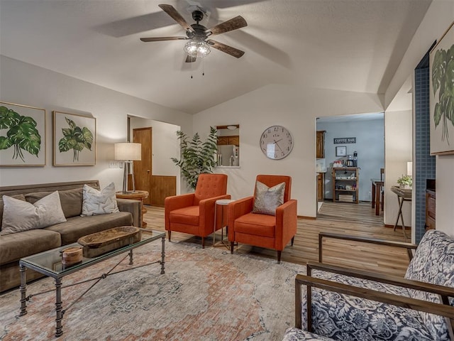 2108 Barton St Unit 2110, Norman, OK 73072 - living room featuring ceiling fan, light wood-type flooring, a fireplace, and lofted ceiling