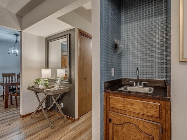 2108 Barton St Unit 2110, Norman, OK 73072 - bathroom featuring vanity, baseboards, and wood finished floors