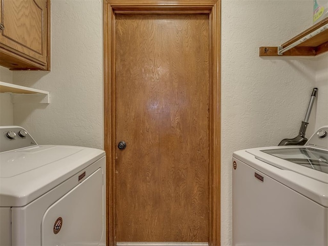 2108 Barton St Unit 2110, Norman, OK 73072 - washroom featuring independent washer and dryer, a textured wall, and cabinet space