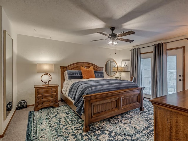 2108 Barton St Unit 2110, Norman, OK 73072 - bedroom featuring access to outside, baseboards, carpet, and a textured ceiling