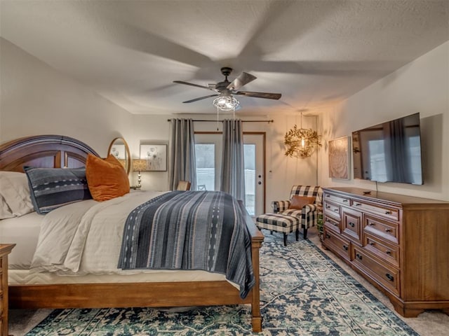 2108 Barton St Unit 2110, Norman, OK 73072 - bedroom featuring a textured ceiling, access to exterior, carpet flooring, and ceiling fan