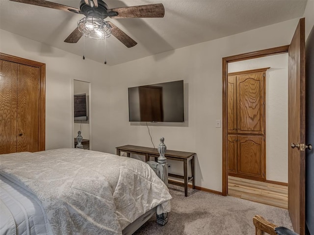 2108 Barton St Unit 2110, Norman, OK 73072 - bedroom with light carpet, baseboards, and ceiling fan