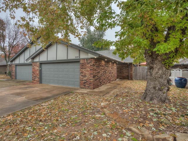 view of side of home with a garage