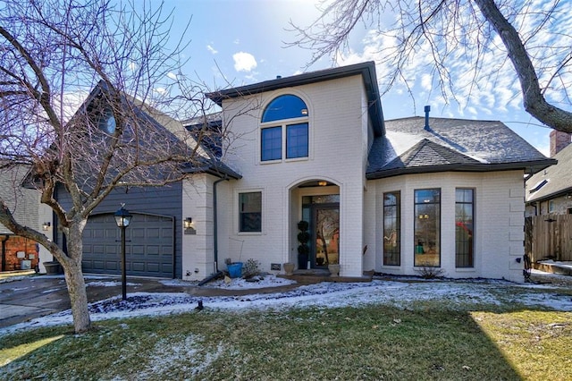 view of front facade with a garage and a front yard