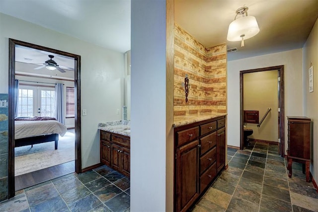 bathroom featuring french doors and vanity