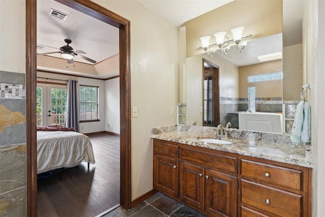 1408 NW 147th St, Edmond, OK 73013 - ensuite bathroom with vanity, a ceiling fan, and a chandelier