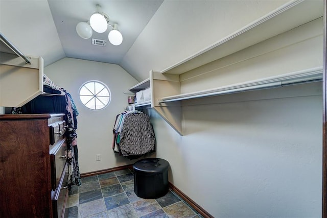 1408 NW 147th St, Edmond, OK 73013 - walk in closet with stone finish flooring and lofted ceiling