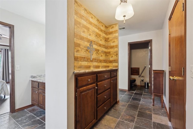 1408 NW 147th St, Edmond, OK 73013 - bathroom with stone tile flooring and vanity