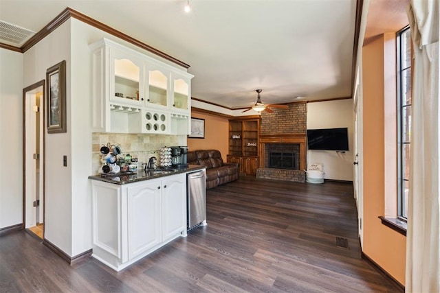 1408 NW 147th St, Edmond, OK 73013 - indoor bar featuring ceiling fan, dark wood finished floors, stainless steel dishwasher, ornamental molding, and backsplash