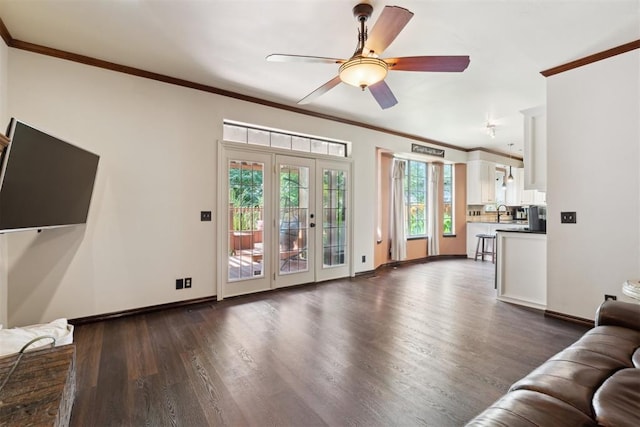 1408 NW 147th St, Edmond, OK 73013 - living room featuring crown molding, dark wood finished floors, a ceiling fan, and french doors