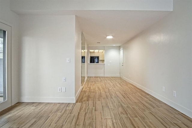 unfurnished room featuring plenty of natural light