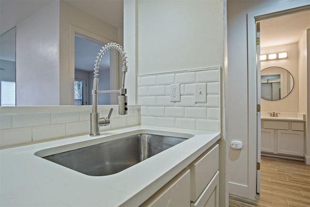 bathroom with vanity and backsplash