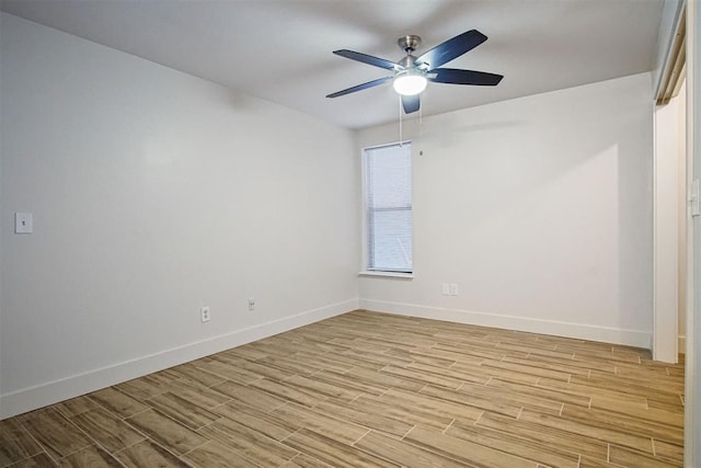 spare room with ceiling fan