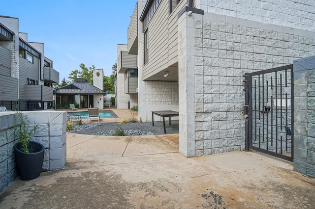 view of patio featuring a fenced in pool