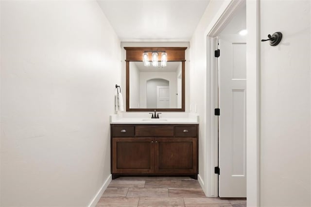 bathroom featuring vanity and baseboards