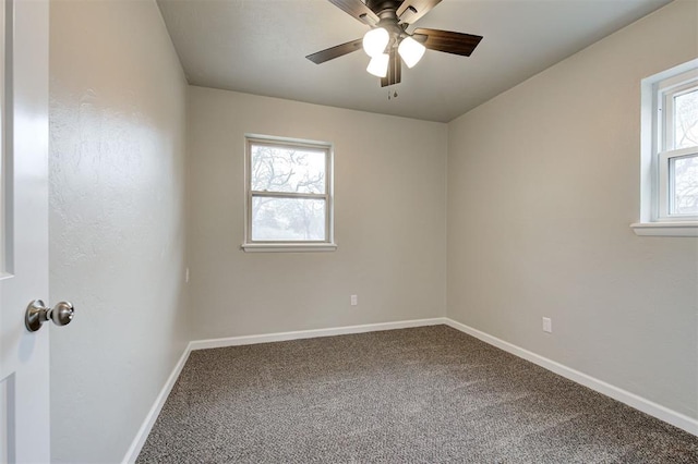 spare room with ceiling fan, a healthy amount of sunlight, and carpet flooring