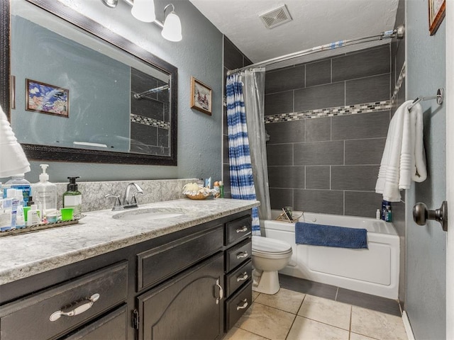 full bathroom featuring vanity, shower / tub combo, tile patterned floors, and toilet