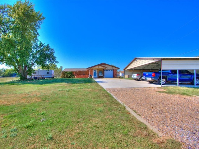 view of yard featuring an outbuilding, a garage, and a carport