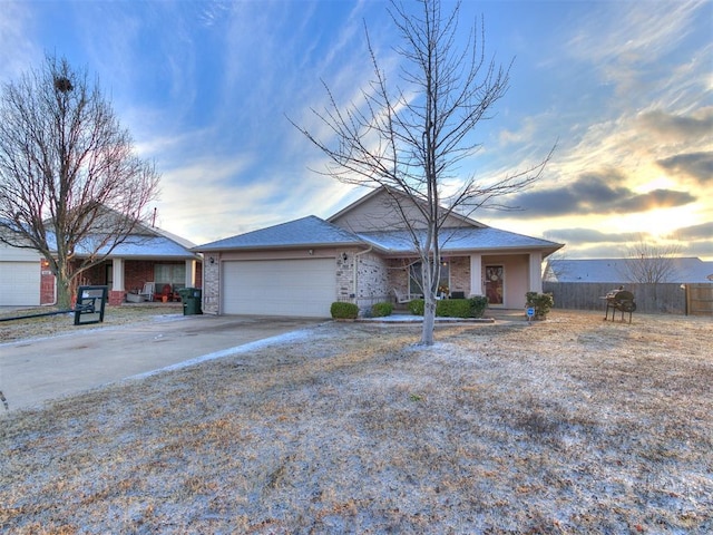 ranch-style house featuring a garage