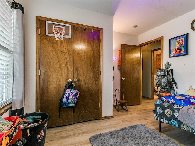 bedroom with light hardwood / wood-style flooring