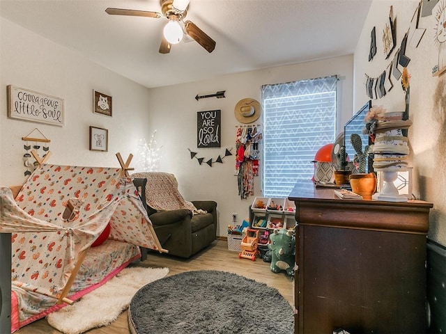 interior space with ceiling fan and light wood-type flooring