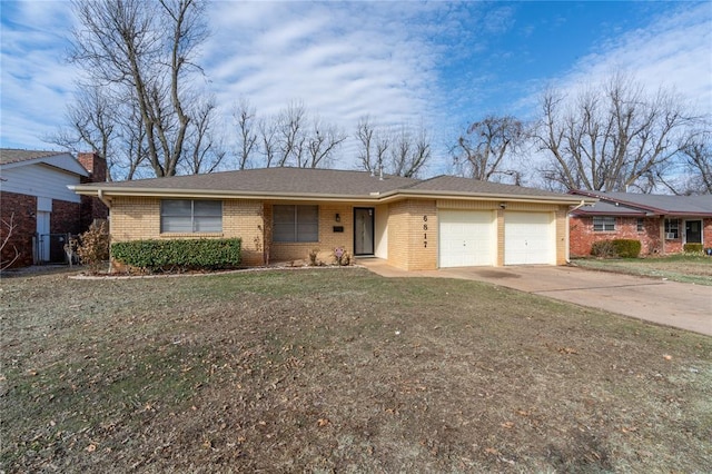 ranch-style home with a garage and a front yard