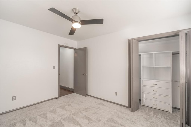 unfurnished bedroom featuring ceiling fan and light carpet