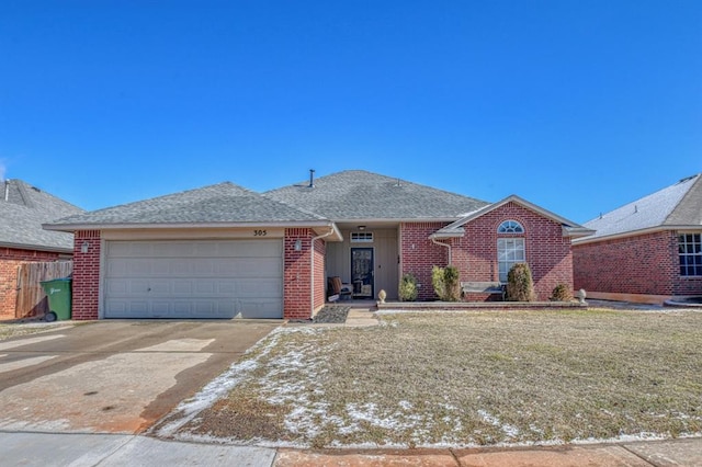 ranch-style house featuring a garage and a front yard