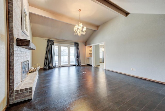 unfurnished living room featuring a notable chandelier, baseboards, dark wood-style flooring, a brick fireplace, and vaulted ceiling with beams