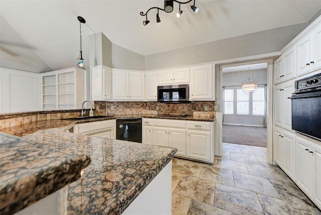 kitchen featuring pendant lighting, vaulted ceiling, black appliances, a sink, and decorative backsplash