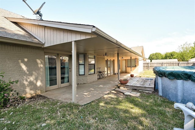 view of patio / terrace featuring a fenced in pool, fence, and ceiling fan