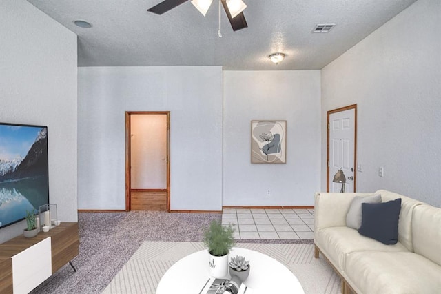 10700 NW 36th Pl, Yukon, OK 73099 - living room with a ceiling fan and a textured ceiling