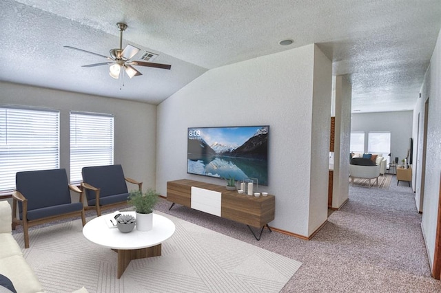 10700 NW 36th Pl, Yukon, OK 73099 - living area with a textured ceiling, carpet, vaulted ceiling, and ceiling fan