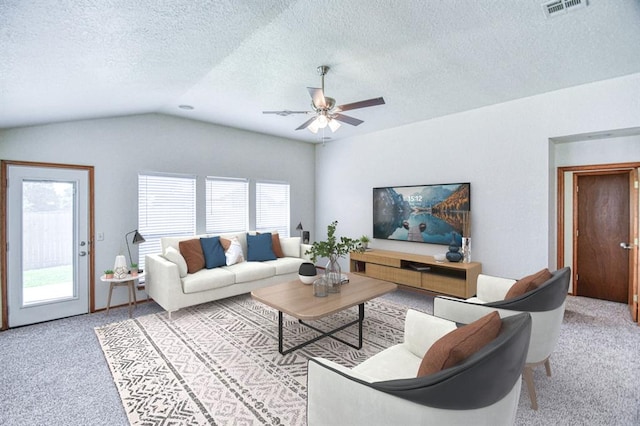 10700 NW 36th Pl, Yukon, OK 73099 - living area with carpet, ceiling fan, lofted ceiling, and a textured ceiling