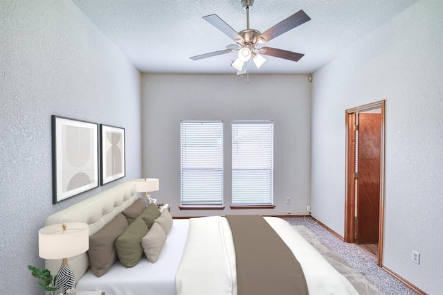 10700 NW 36th Pl, Yukon, OK 73099 - bedroom with light carpet, a textured wall, a textured ceiling, a ceiling fan, and baseboards