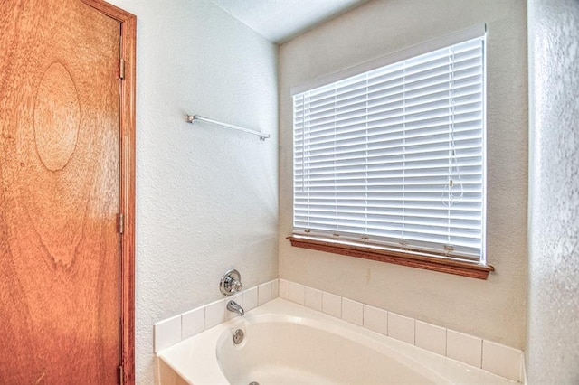 10700 NW 36th Pl, Yukon, OK 73099 - full bath with a garden tub and a textured wall