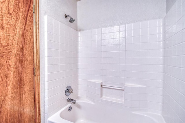 10700 NW 36th Pl, Yukon, OK 73099 - bathroom featuring shower / bath combination and a textured wall