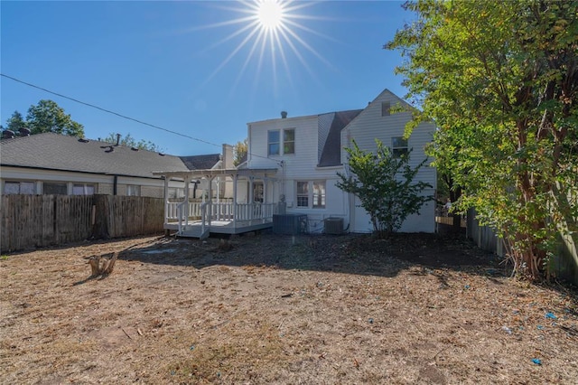 back of property with a wooden deck