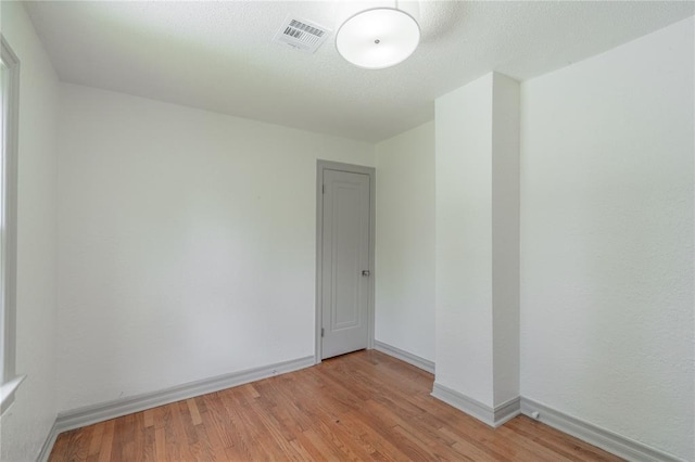 3125 NW 24th St, Oklahoma City, OK 73107 - unfurnished room featuring light wood finished floors and baseboards