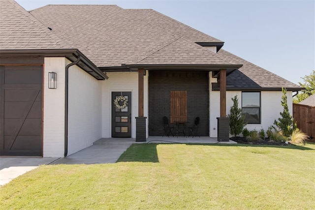 view of front of property with a garage and a front yard