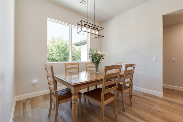 dining area featuring light wood-type flooring