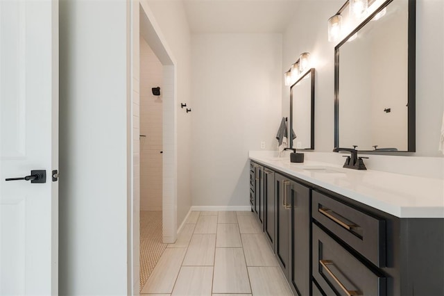 bathroom featuring vanity and a tile shower