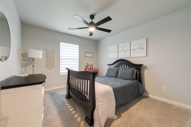 bedroom featuring ceiling fan and light carpet