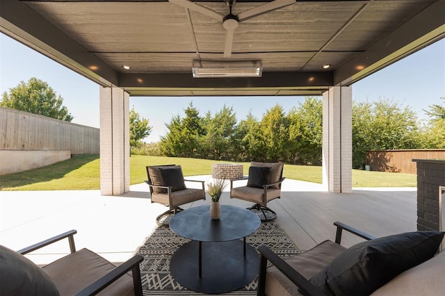 view of patio / terrace featuring ceiling fan and an outdoor living space