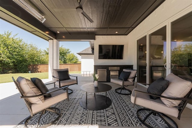 view of patio / terrace with ceiling fan and an outdoor hangout area