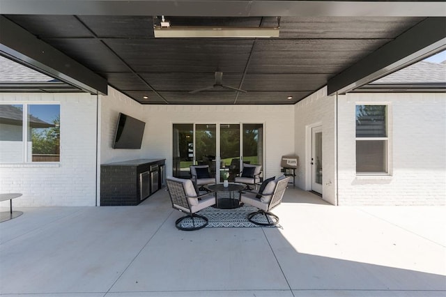 view of patio with ceiling fan and outdoor lounge area