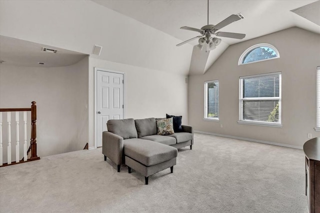 living room with vaulted ceiling, light carpet, and ceiling fan