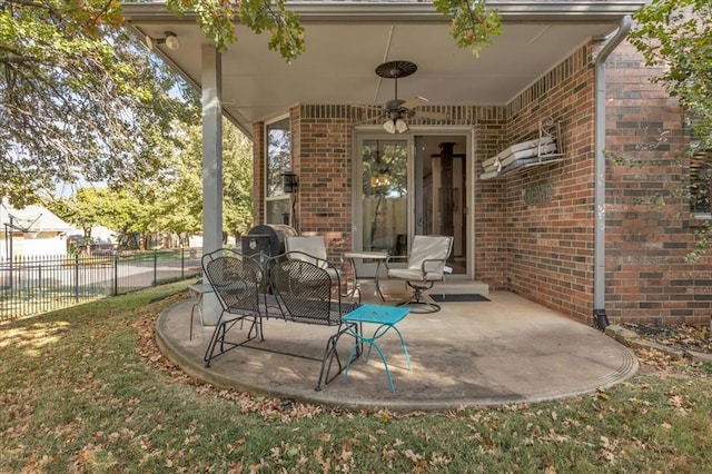 view of patio featuring ceiling fan