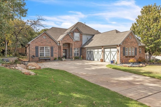 view of front of house featuring a garage and a front yard